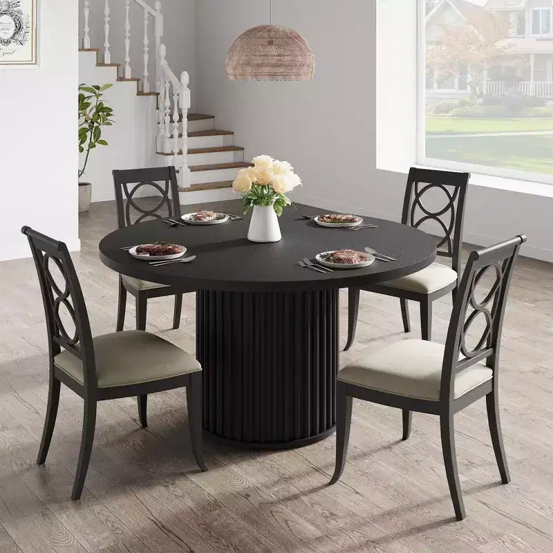 Tavolo da pranzo rotondo nero per 4 persone, base a piedistallo ondulata, 119 cm